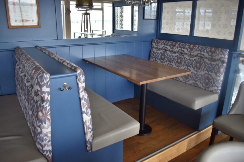 An unoccupied booth in a restaurant.