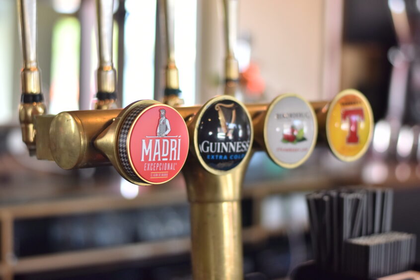 Beer taps in a pub.