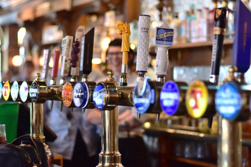 A range of beer taps in Trades House pub in Dundee.