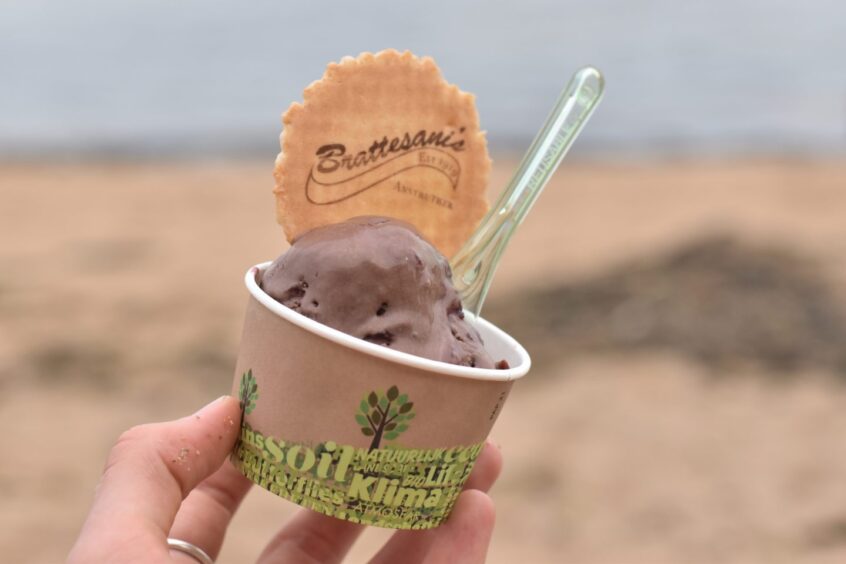 A tub of chocolate cherry ice cream and wafer from Brattesani's