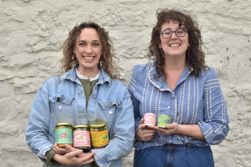 Lucy Patto Davidson, left, and Kat Goldin holding some of the products they have released under the Goat Rodeo Goods brand.