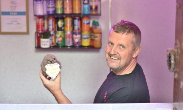 Dean Duncan posing inside The Topped Tattie.