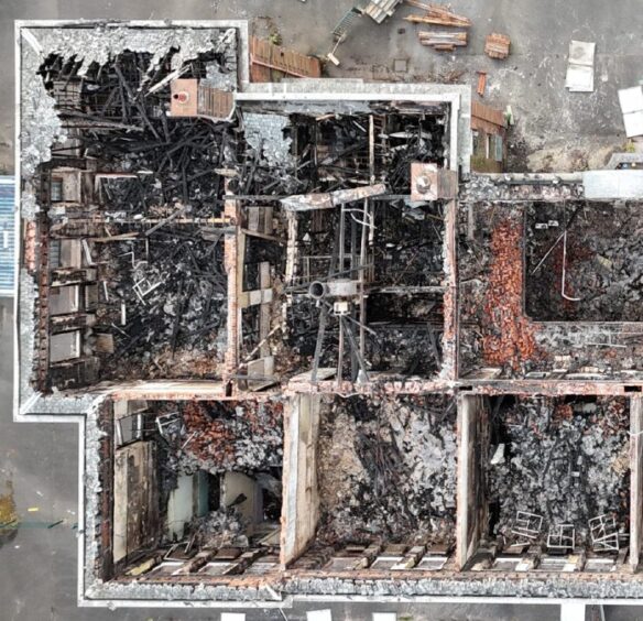 View from a drone of a fire-ravaged building. 