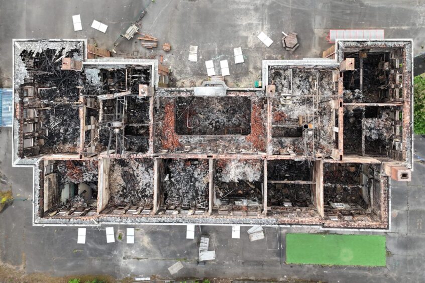 View from a drone of a fire-ravaged building. 