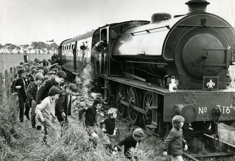 The Cubs get out for a look round the train at Lochty.