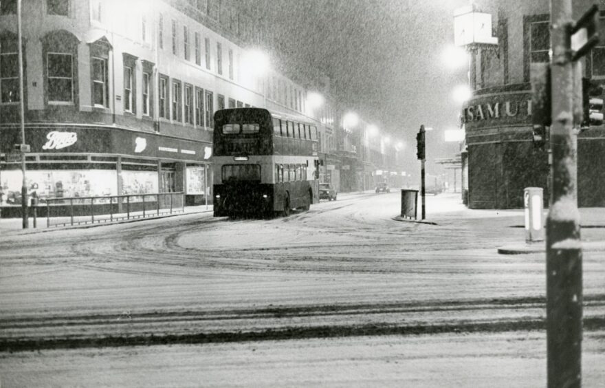 A bus travels down a wintry Reform Street in 1979. 