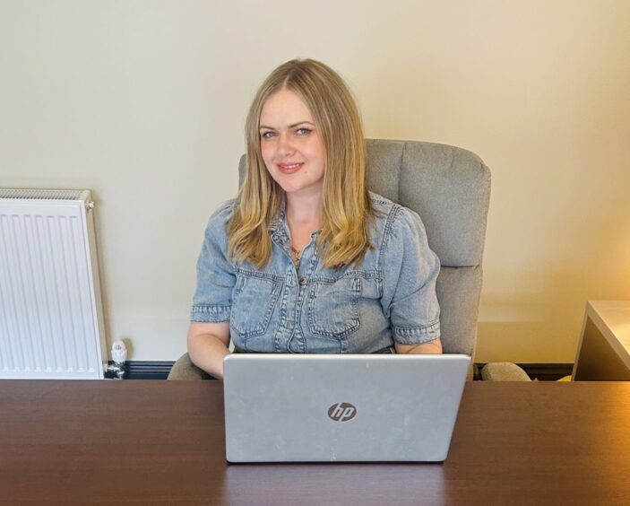 Franki at desk with laptop