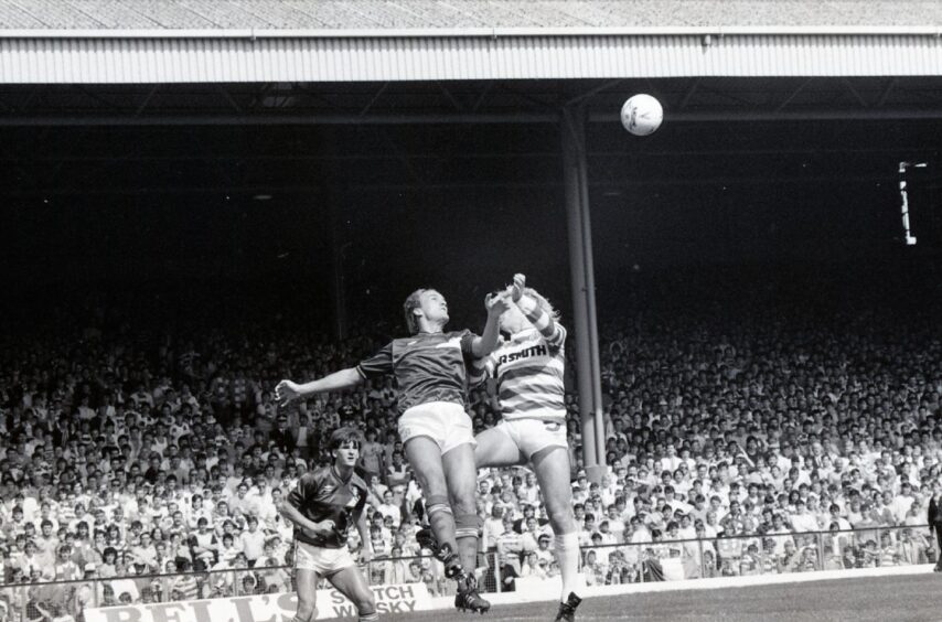 Jim Duffy wins a header against Maurice Johnstone at Celtic Park in August 1986. 