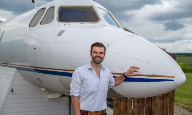 Iain Gall with the converted aircraft. Image: Richard Hancox/DC Thomson