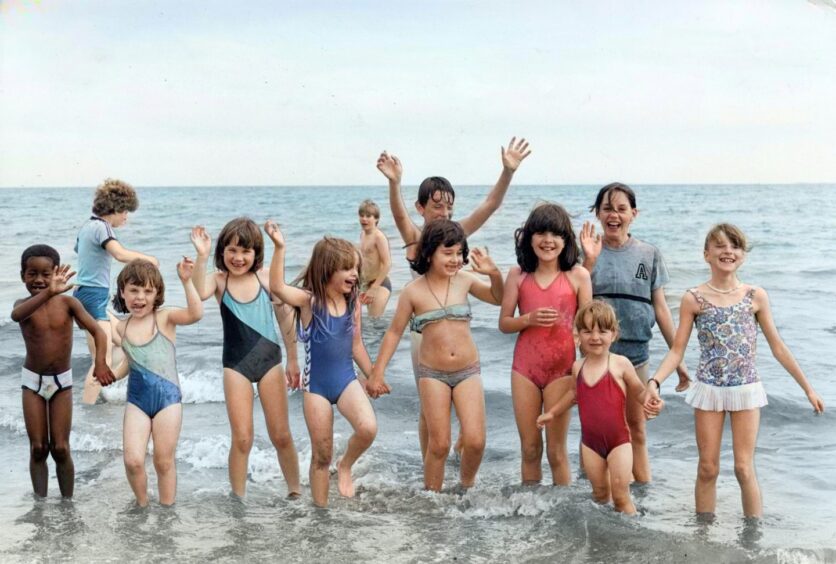 A group of youngsters enjoying a splash in the water at Broughty Ferry in July 1985.
