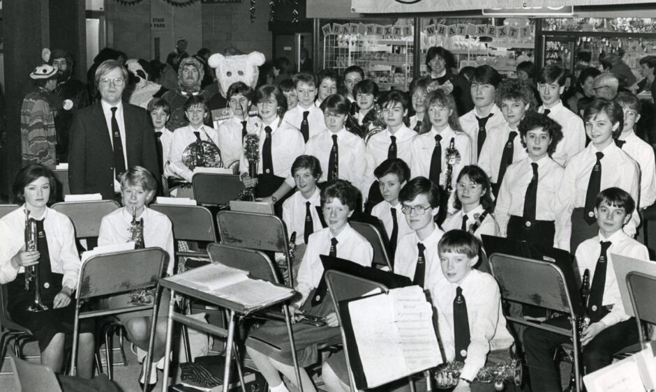 Craigie High School brass band in 1986 seated with their instruments