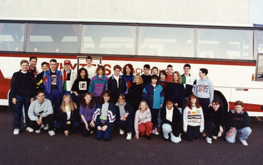 Craigie High School pupils stand beside a coach in October 1991. 