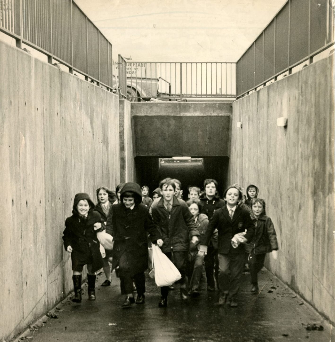 Pupils walk through the new subway. 