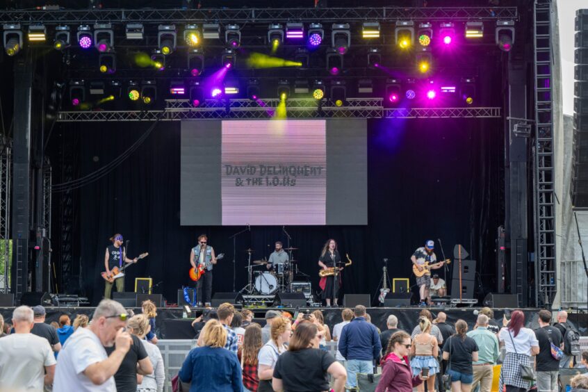 David Delinquent and The IOU's on stage.