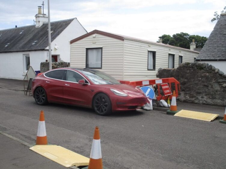 Car parked in front of Carnoustie caravan in enforcement row