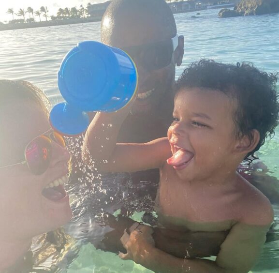 Lesley, her son Leo and partner Victor having fun in the sea.