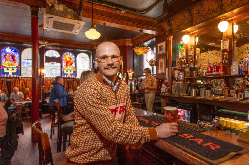 Jacob Smith standing at the bar in The Phoenix.