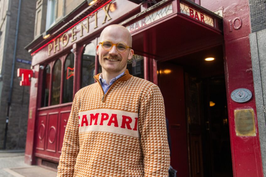 Jacob Smith standing outside The Phoenix bar in Dundee