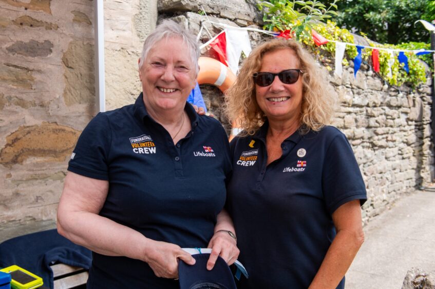 Two women smiling. 