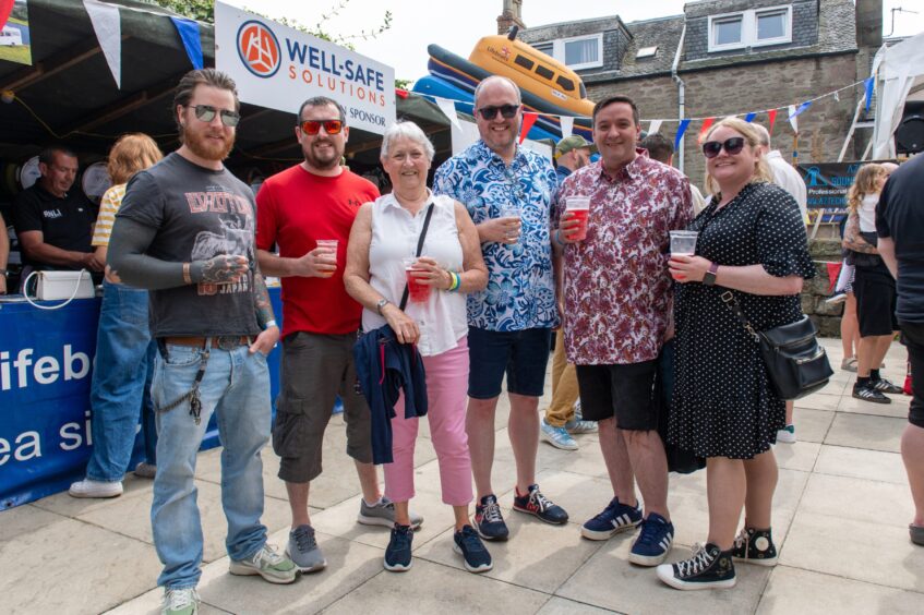 Festival-goers posing for a photograph. 