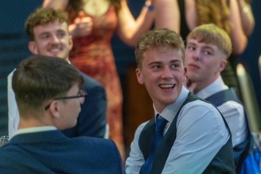 Young men smiling at the event