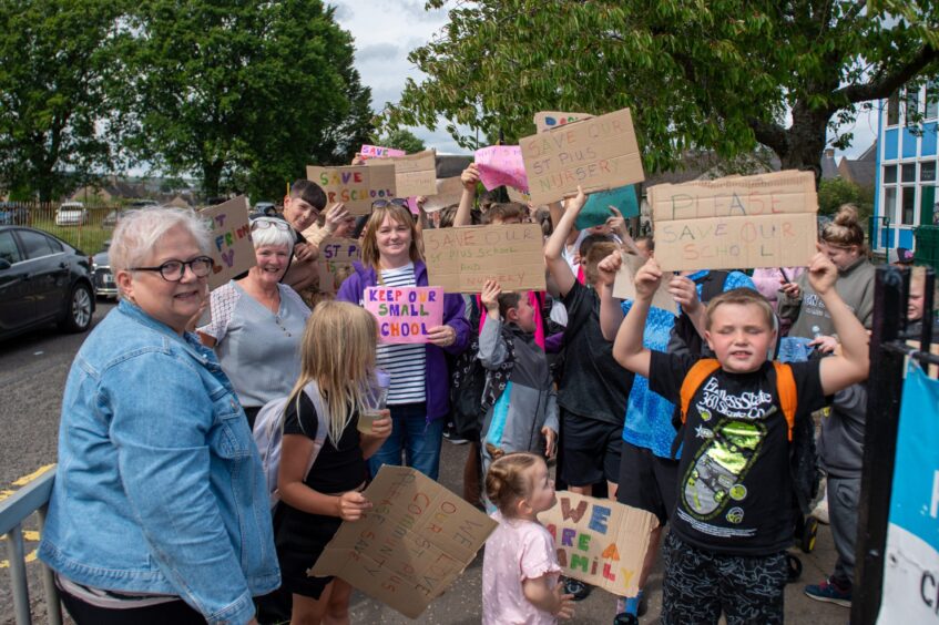 Patricia Brough, left, with other protesters, says the closure of St Pius will 'rip the heart out of Douglas'. 