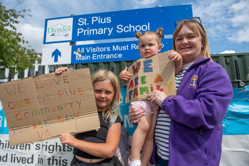 School pupil Ayla Squire and Rosie Brady, from the nursery, with their grandmother Marion Swan, who is leading the campaign to save St Pius X RC Primary School.