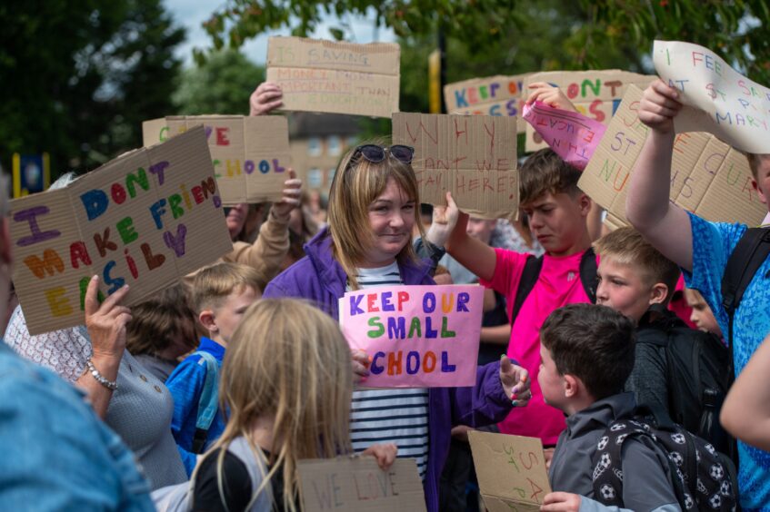 Protesters with placards outside St Pius X RC Primary School, Dundee. 