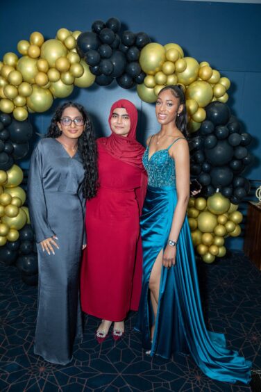 Deia Costa, Areej Samoo and Natania Robinson at the Morgan Academy prom 2025.
