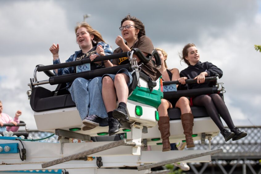 Young people on a funfair ride