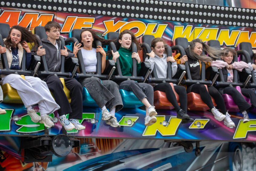 Young people on a funfair ride