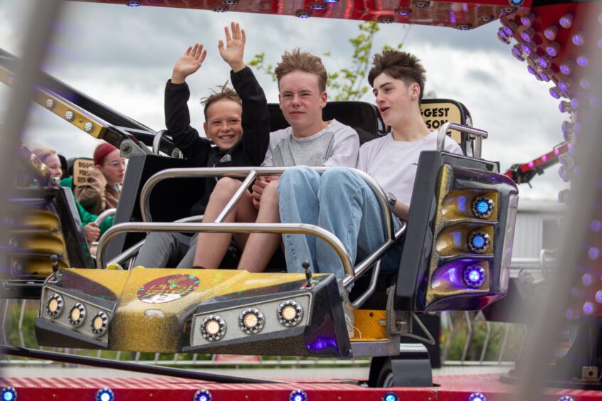 Young people on a funfair ride