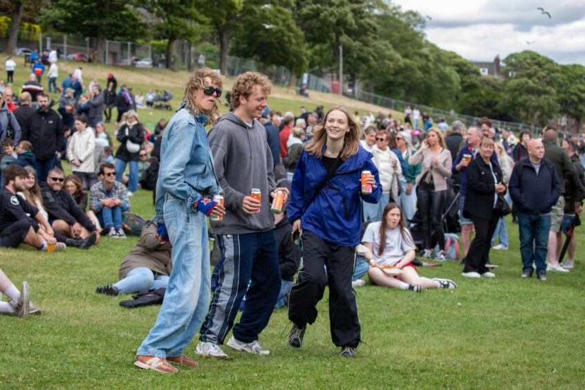People dance along to the music.