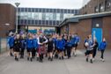 Piping pupil Robbie Melvin leads the farewell to Monifieth High. Image: Kenny Smith/DC Thomson