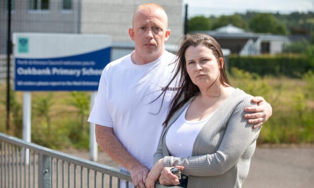 Philip and Gemma Marshall outside Oakbank Primary School in Perth.