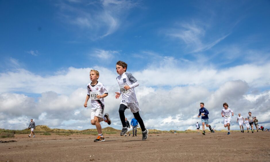 Two young runners compete in the race.