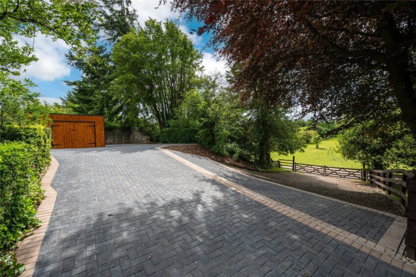 The large paved driveway. 