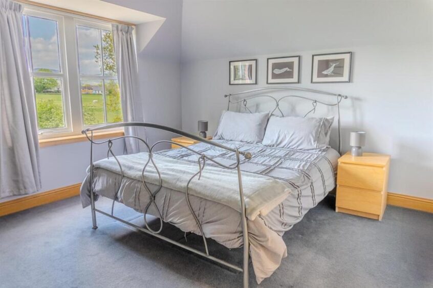 Another of the six bedrooms.