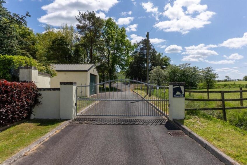 Electric gated private entrance and driveway at the Kinross-shire property.