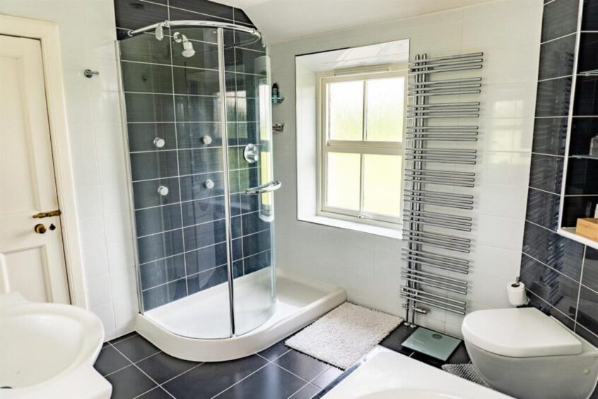 One of two en suite bathrooms.