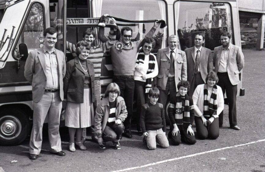 United fans beside a bus in Dundee in 1981.