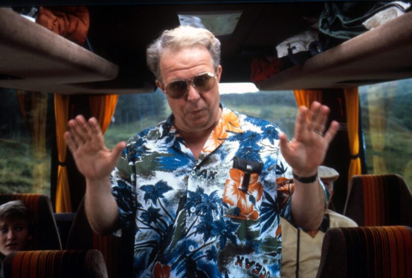 Ned Beatty on a bus in a scene from Restless Natives in 1985