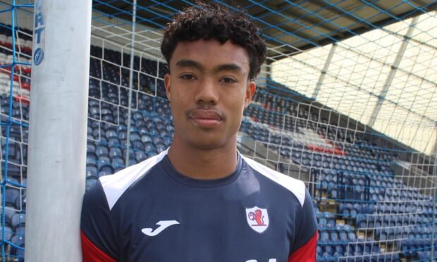 Raith Rovers attacker Richard Chin leans against a goalpost at Stark's Park.