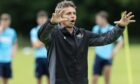 Simo Valakari issues an instruction to his players in training.