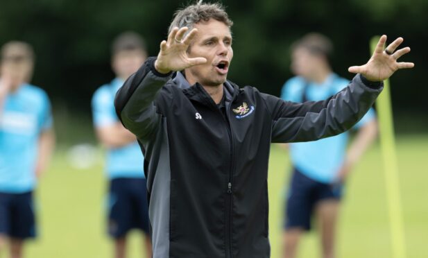 Simo Valakari issues an instruction to his players in training.