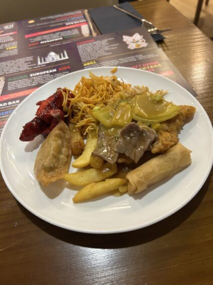 A plate of Chinese food - including chips, spring rolls and chow mein - from Booffi World Buffet.