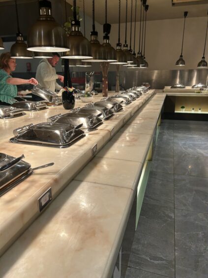 A serving counter at Booffi World Buffet.