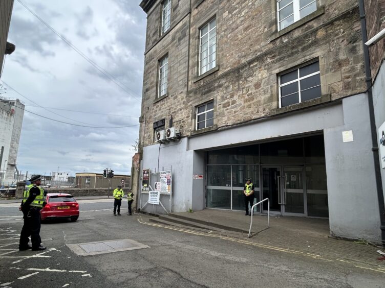 Police entering the former Fife Collage building after discovering the "major" cannabis farm.