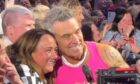 Debbie Allan with Robbie Williams at Murrayfield.