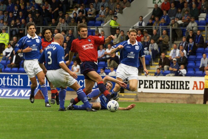 Nemsadze takes on the St Johnstone defence, dribbling through four players